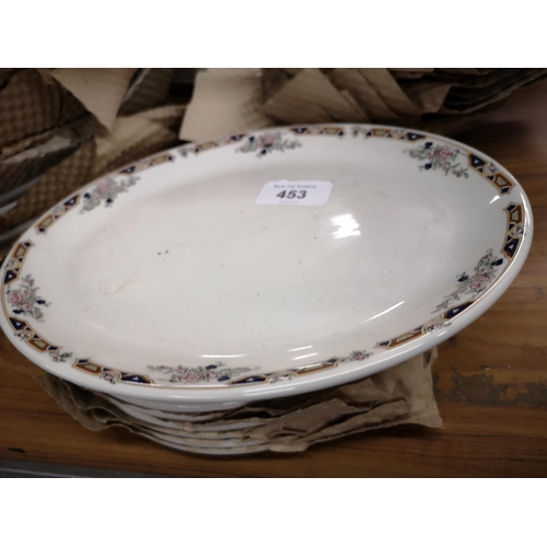 453 - 7 catering side plates and 1 matching oval plate.