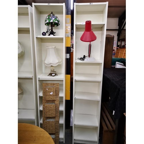 551 - Pair of white eight foot x one foot white shelf units