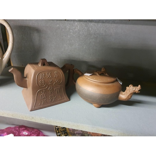 716E - Two Chinese terracotta teapots – decorative designs