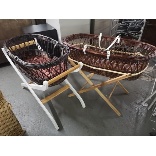 335 - Two wicker Moses baskets with wooden stands.