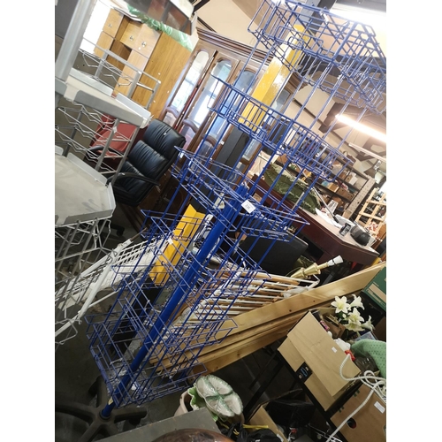 336 - Tall blue spinning display stand on wheels. Approx 180cm tall