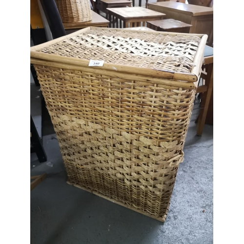 340 - Large wicker linen basket. Approx 68x50x40cm