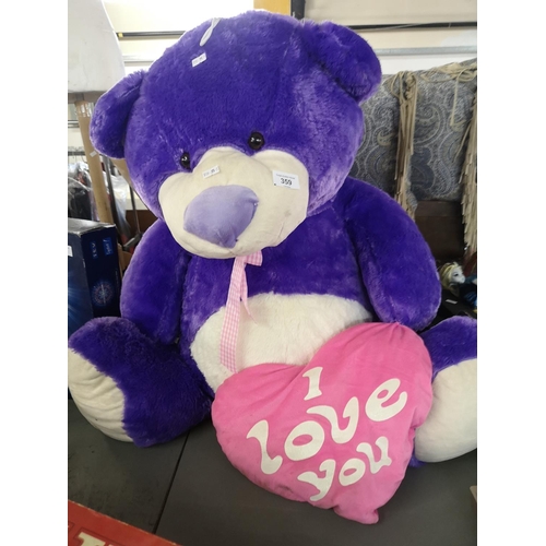 359 - Large purple teddy bear with 'I love you' heart. Approx 75cm tall