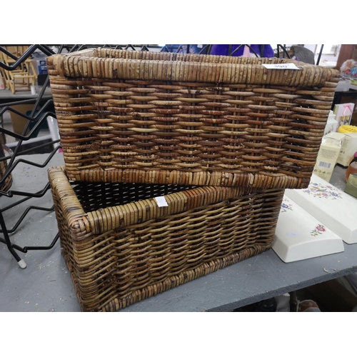 390 - Pair of wicker baskets. Approx 16x17x34cm each