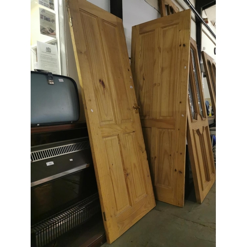 310 - Two internal pine doors, 197 cm x 69 cm.