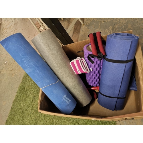 135 - Box with exercise mats and exercise rollers