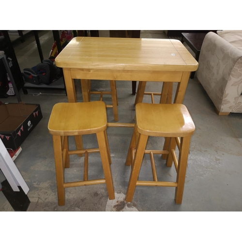 660 - Heavy wooden table with four stools, table measures 90 x 60 x 91 cm, stools are 66 cm tall approx.