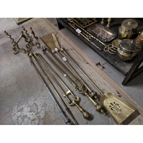 476 - Pair of vintage brass fire dogs and brass fireside companion tools.