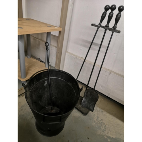 482 - Black metal fireside companion set 70 cm high, with black metal coal bucket and brush.