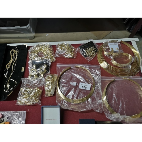 578 - Job lot of gold coloured fashion jewellery, including necklaces, earrings etc.