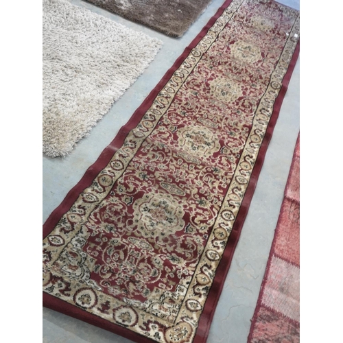 651 - Multi coloured patterned carpet runner 11' x 2'6