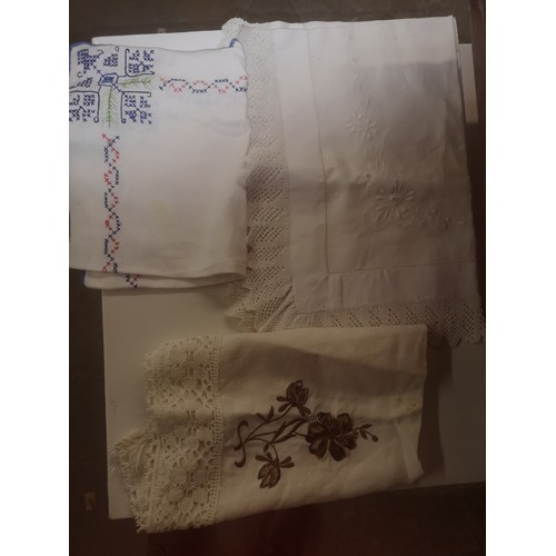 304 - Collection of vintage linen, some embroidery items in case.