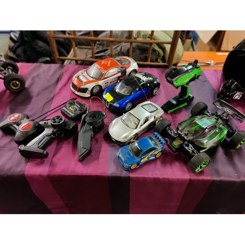 23 - Large collection of radio control cars and controllers