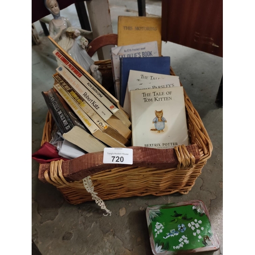 720 - Wicker Basket with contents of linen, figurine and vintage Books including Beatrix Potter, Battle of... 
