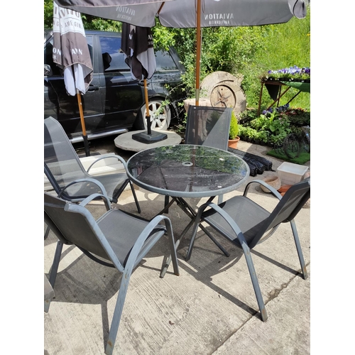 42 - garden table round glass top with 4 chairs in black