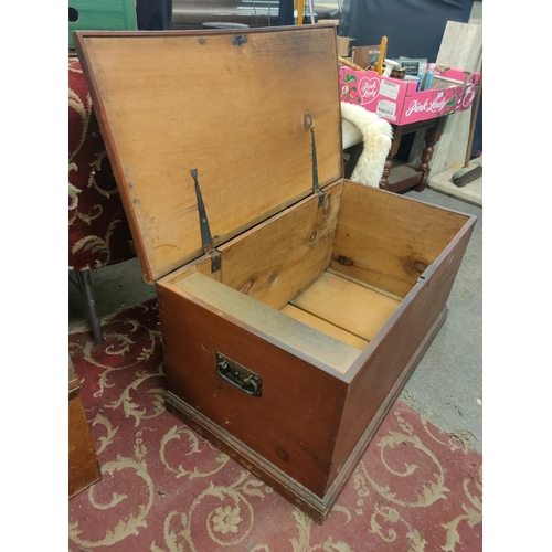 723 - Large wooden storage chest with cast handles. Approximately 88 x 47 x 44 cm