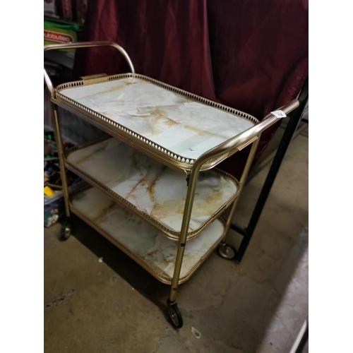 738 - Vintage metal serving trolley. Three tiered with marble effect shelves