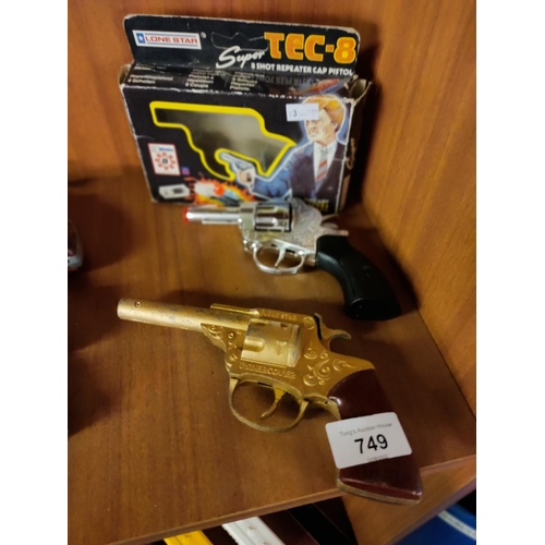 749 - A vintage boxed lone star tec-8 repeating cap pistol and a lone star undercover