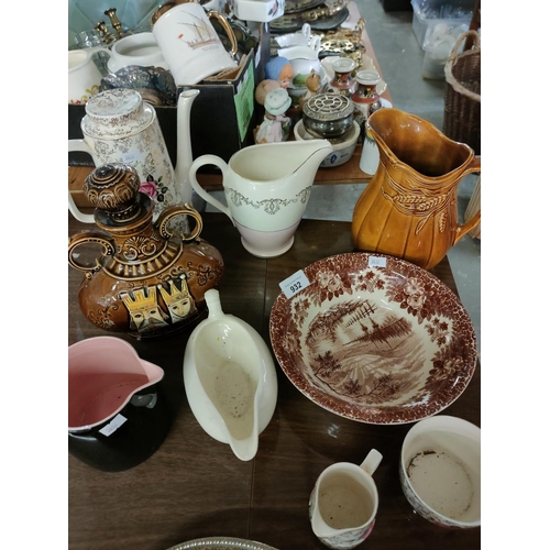 932 - Collection of items including iron stone bowl, and various jugs