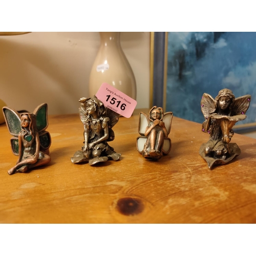 1516 - Set of four decorative metal fairy figures