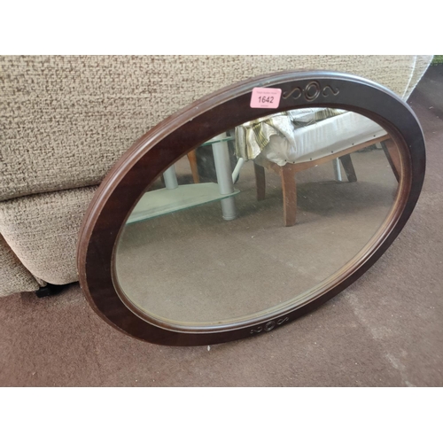 1642 - Wood framed oval wall mirror