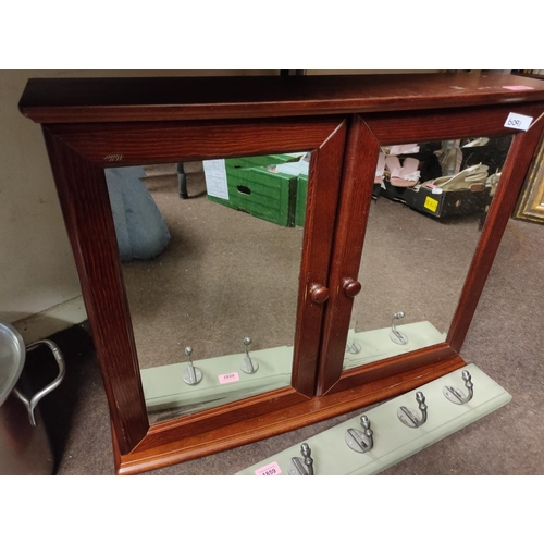 1858 - Two mirror fronted door bathroom cabinet. Approximately 65 x 57 cm