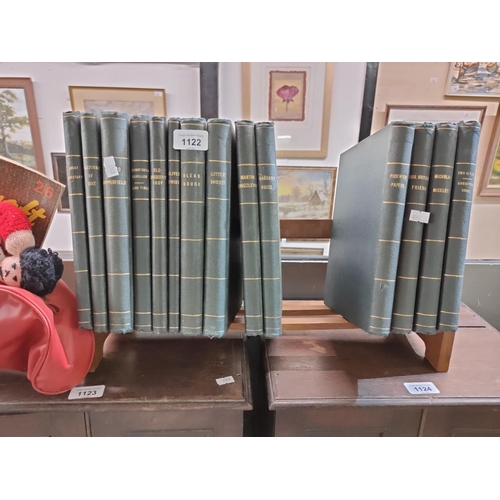 1122 - Collection of Charles Dickens books on wooden stand