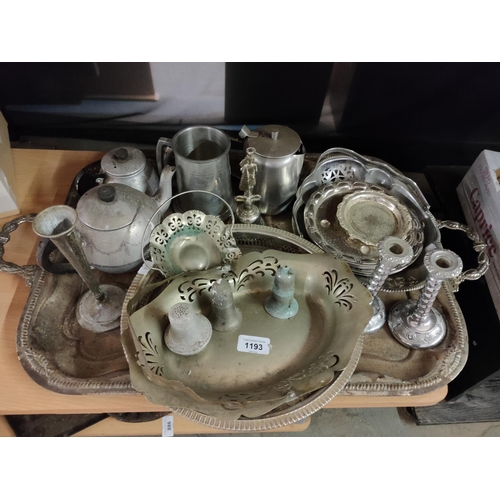 1193 - A mixed collection of metal ware including trays and a pair of silver coloured candlesticks