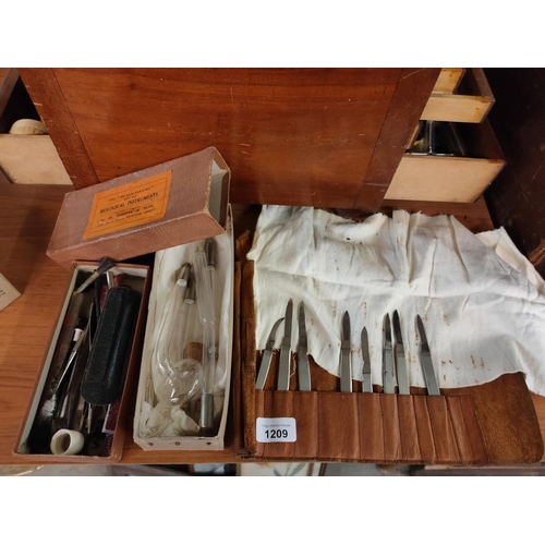 1209 - A leather folding pouch with scalpel knives and a selection of other vintage instruments