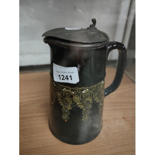 1241 - A ceramic jug with pewter lid