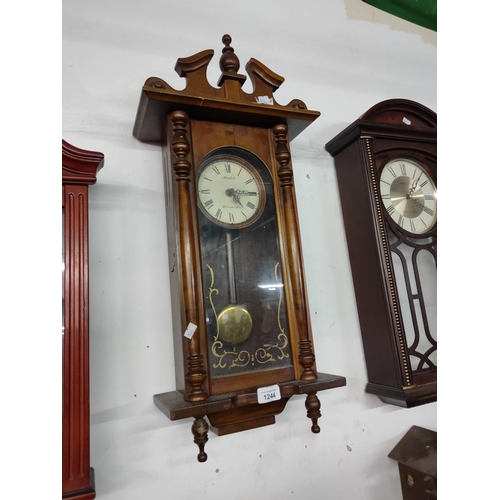 1244 - A nice wall hanging clock with pendulum