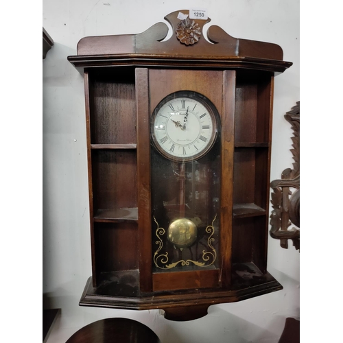 1250 - A mahogany wall mounted clock with Westminster chime