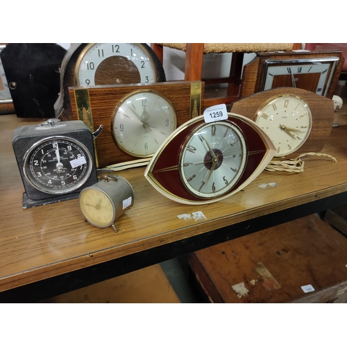 1259 - A collection of three retro mantle clocks, electric with cables removed. Including two Metamec and o... 