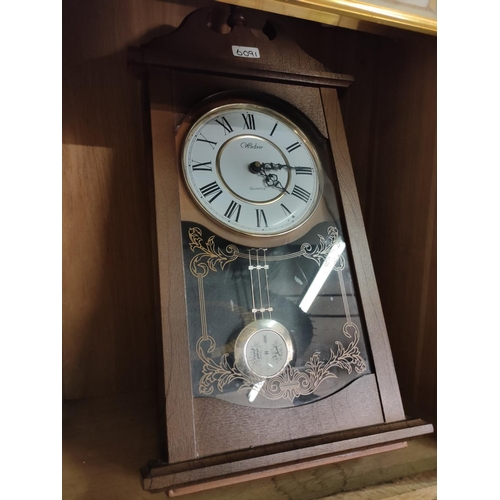 1275 - A reproduction wall hanging clock with quartz movement