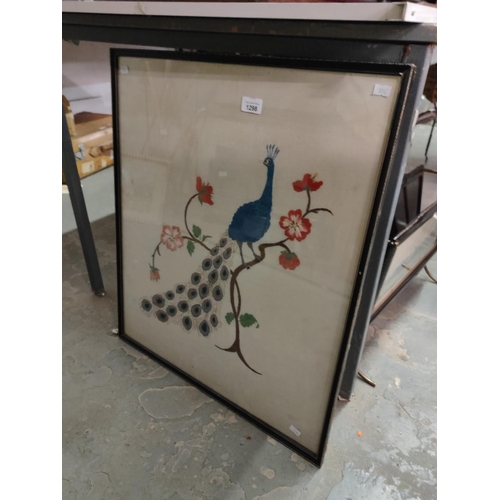 1298 - A large framed embroidery picture of a peacock