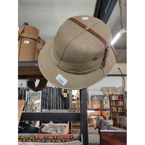 1351 - A vintage Pith helmet, from Evans Fraser & Co