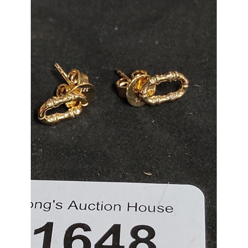 1648 - A pair of gold coloured stud earrings