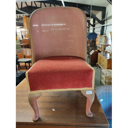 1892 - A vintage Lloyd Loom style nursing chair with padded seat in original pink colour