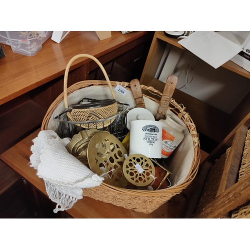 2268 - Collection of mixed items including brass, carved wooden spoons and cheese jars in basket