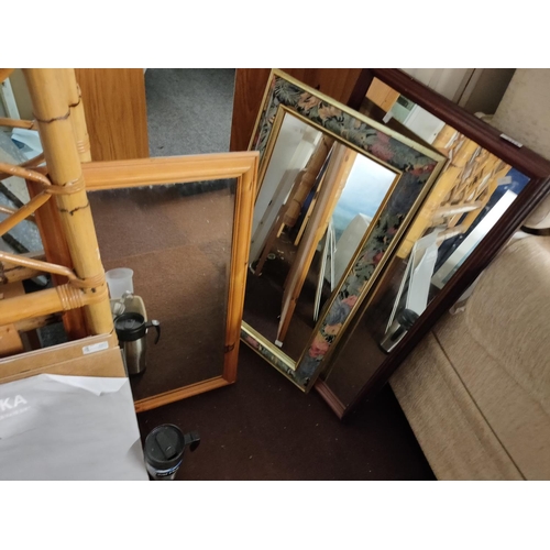 2374 - Two mirrors one in a dark wood frame and the other in a floral frame