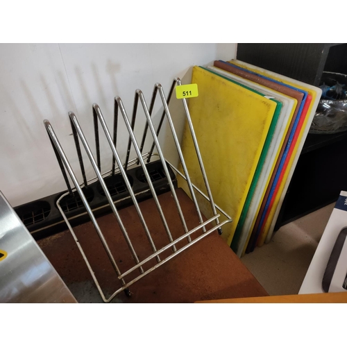 511 - A large plate or pan lid rack and a quantity of used professional chopping boards