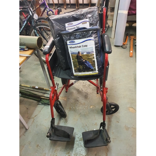 447 - Ableworld red folding wheelchair with brand new pressure tex cushion and brand new wheelchair cosy