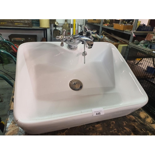 448 - A ceramic sink and taps