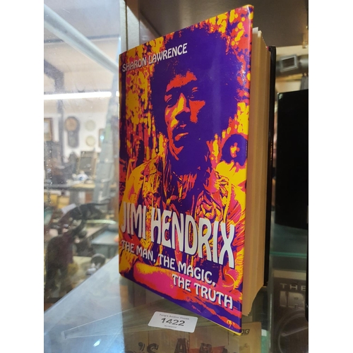 1422 - 'Jimi Hendrix The man the magic the truth' by Sharon Lawrence. Inserted on a glued in piece of paper... 