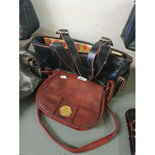 524 - Two attractive handbags, one red and one black with pink detail