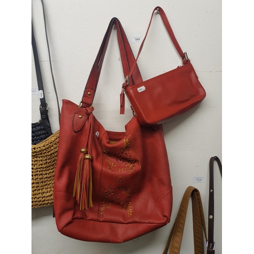 540 - Two red handbags including oasis