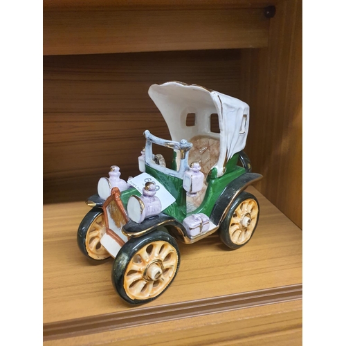 689 - Ceramic vintage car figurine