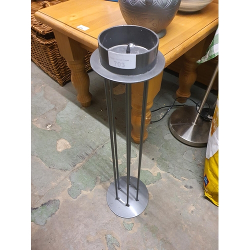 703 - Tall metal candle holder. Approximately 60 cm tall