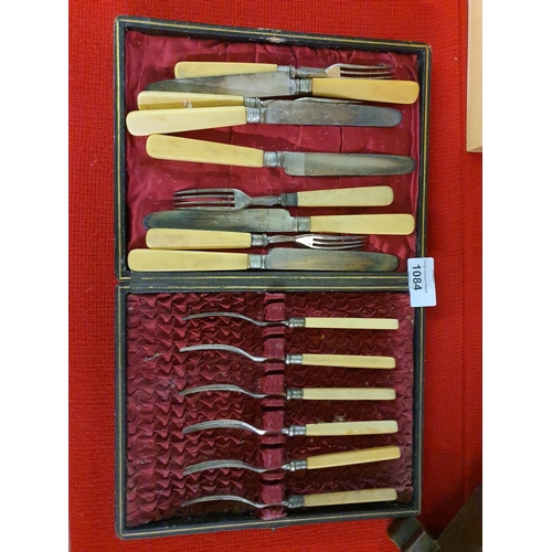 1084 - Antique set of bone handled knives and forks