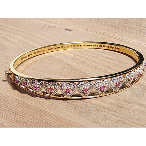 1328O - Attractive yellow gold plated bangle with 12 round cut rubies and diamonds and clasp